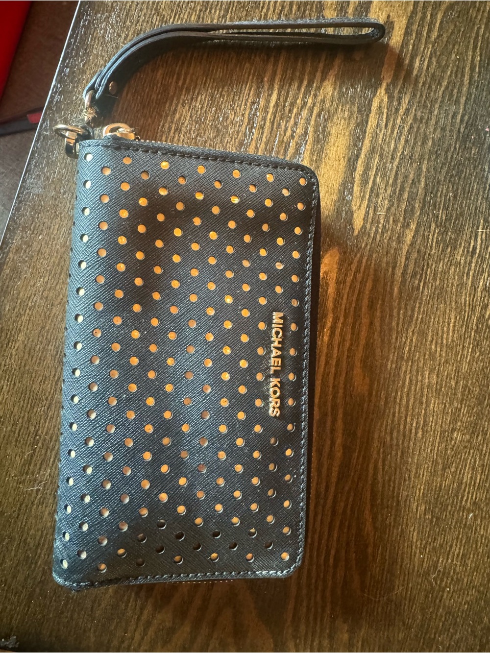 Michael Kors Black Perforated Wristlet Phone Case with Gold Logo